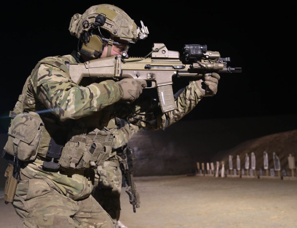 A coalition forces member fires his Special Operations Forces Combat Assault Rifle (SCAR) during marksmanship training on a range on Kandahar Air Field, in Kandahar Province, Afghanistan, on Jan 15, 2014. Coalition forces qualified with various weapon systems to maintain their proficiency. (U.S. Army Photo by Pfc. Dacotah Lane/ Released)